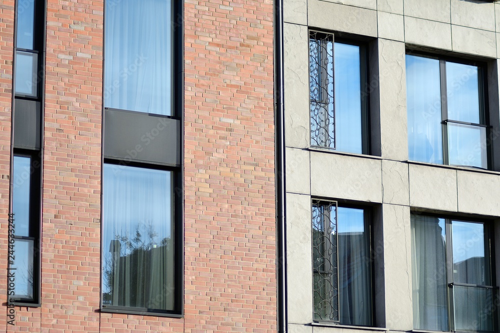 Modern apartment buildings on a sunny day with a blue sky. Facade of a modern apartment building