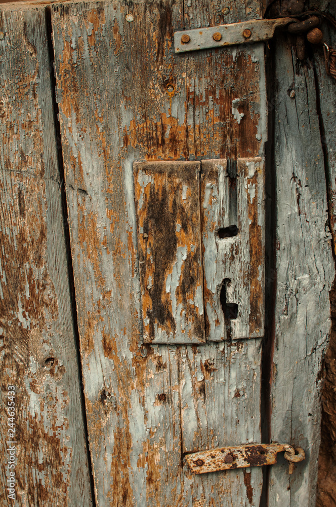 Old grunge weathered aged wooden rural door detail closeup Old grunge weathered aged wooden rural door detail closeup
