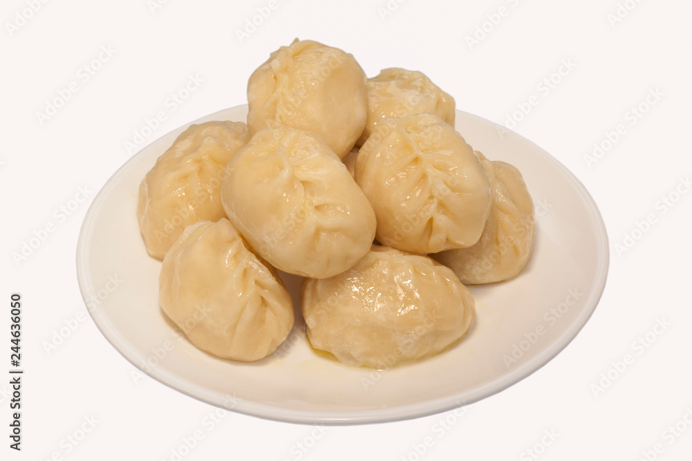 manti dumplings ravioli great big huge on a plate close-up menu for the cafe restaurant isolated white background