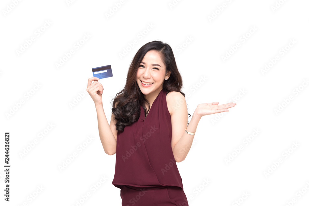 Young smiling beautiful Asian woman presenting credit card in hand for making payment shopping isolated on white background Young smiling beautiful Asian woman presenting credit card in hand for making payment shopping isolated on white background
