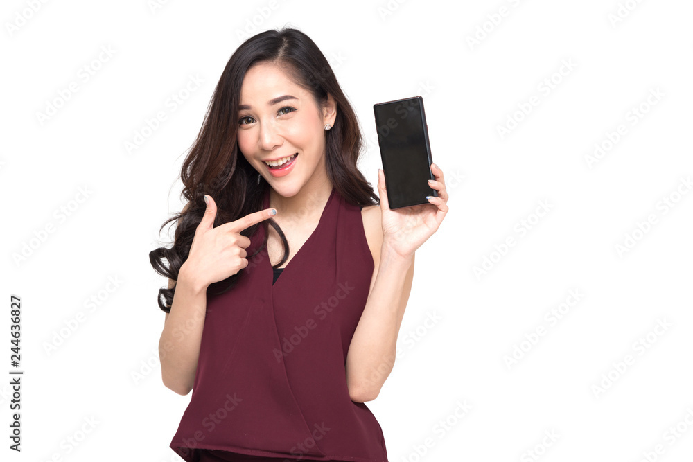 Portrait of a cheerful beautiful girl wearing red dress and showing or presenting mobile phone application and pointing finger to smartphone on hand isolated over white background, Asian Thai model Portrait of a cheerful beautiful girl wearing red dress and showing or presenting mobile phone application and pointing finger to smartphone on hand isolated over white background, Asian Thai model