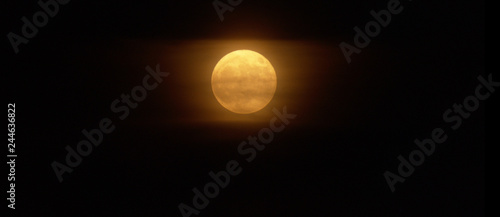 Close up of foggy yellow moon