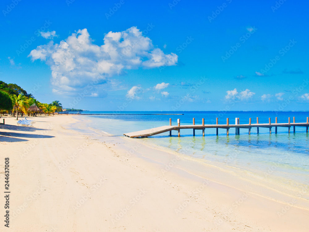 Caribbean beach with a pier