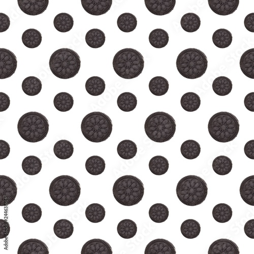Chocolate cookies on white background top view, seamless pattern