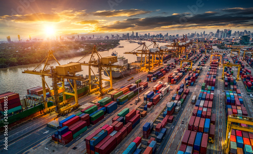 Container ship in import export and business logistic, By crane, Trade Port, Shipping cargo to harbor, Aerial view from drone, International transportation, Business logistics concept © Travel mania