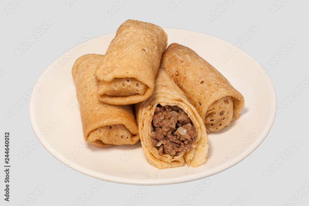 Traditional Russian Fried Stuffed Pancakes Blintzes with Meat.