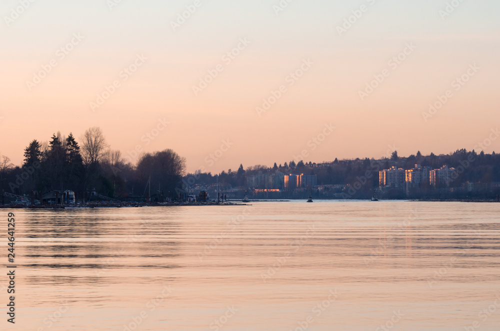 Fraser River at sunset with view on Vancouver's River District