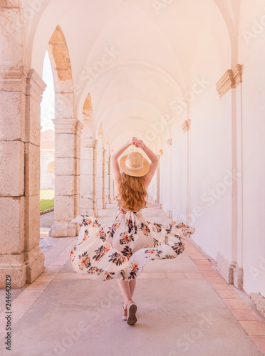 Girl in Europe. Gorgeous woman in beautiful dress walking on street of old Italian city. Travel concept. Beautiful girl in white dress. Fashion model street background.