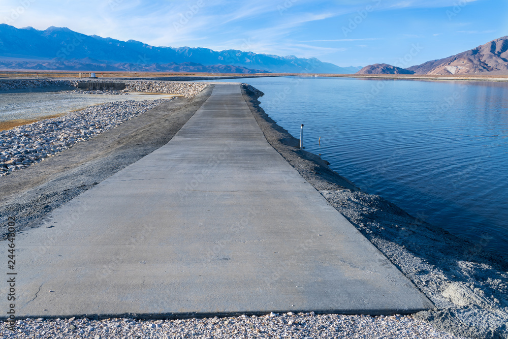 Concrete service road on Owens Lake, California, USA Concrete service road on Owens Lake, California, USA