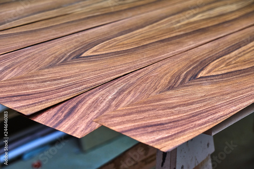 Santos Rosewood veneer . Wood texture. Woodworking and carpentry production. photo
