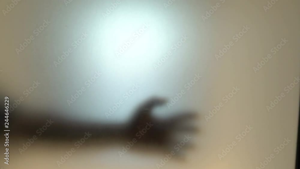 silhouette of hand on mirror,Horror movie concept,Halloween festival scene silhouette of hand on mirror,Horror movie concept,Halloween festival scene