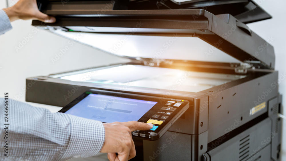 Business man Hand press button on panel of printer, printer scanner laser office copy machine supplies start Business man Hand press button on panel of printer, printer scanner laser office copy machine supplies start