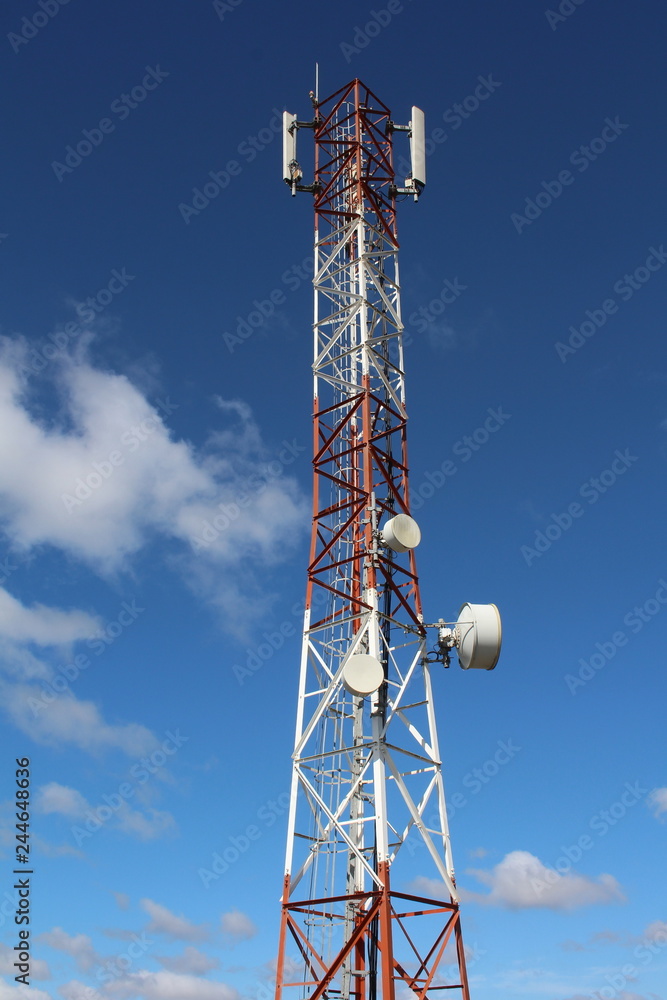 Telecommunications mast showing lattice steel and dish antennas. Telecommunications mast showing lattice steel and dish antennas.