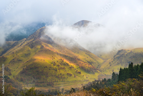 Mountain with morning mist is seen from Yufuin town, Japan
