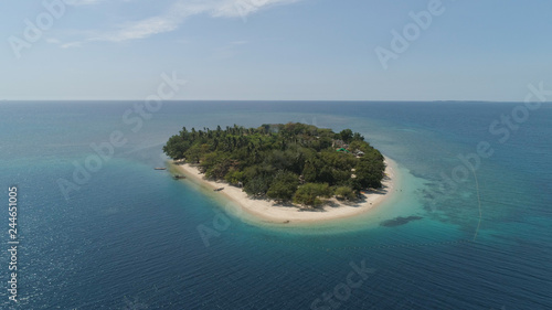 Tropical island with white sandy beach. Aerial view: Putipot island with colorful reef. Seascape, ocean and beautiful beach paradise. Philippines,Luzon. Travel concept.