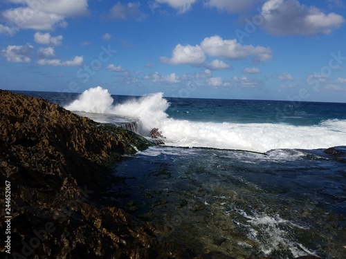 rocky shore at beach with waves in Isabela, Puerto Rico
