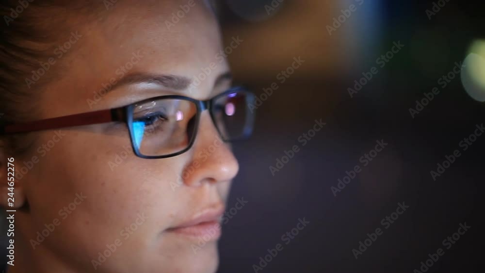 Portrait of young beautiful caucasian woman using smart phone hand hold outdoor in the city night, smiling, face illuminated screenlight - social network, technology, comunication concept Portrait of young beautiful caucasian woman using smart phone hand hold outdoor in the city night, smiling, face illuminated screenlight - social network, technology, comunication concept