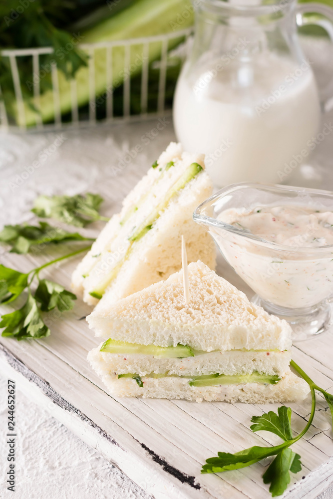 Summer snack mini sandwiches with cucumber and yogurt sauce