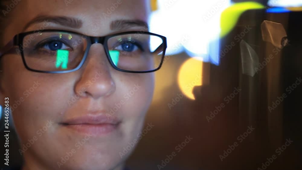 Portrait of young beautiful caucasian woman using smart phone hand hold outdoor in the city night, smiling, face illuminated screenlight - social network, technology, comunication concept Portrait of young beautiful caucasian woman using smart phone hand hold outdoor in the city night, smiling, face illuminated screenlight - social network, technology, comunication concept
