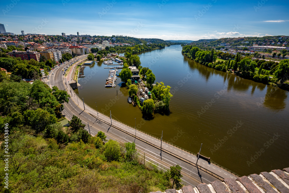 PRAGUE, CZECH REPUBLIC - AUGUST 29, 2015: Beautiful green water park with yachts is built on East bank of Vltava river, Prague, residential part of Czech Republic capital. Summer high angle view