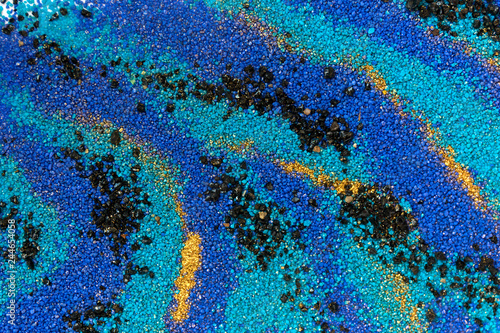 Fototapeta Naklejka Na Ścianę i Meble -  Layered colorful sand pattern. Marble style background. Blue and gold powder texture.