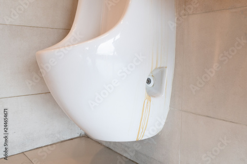 cracks on the urinal and surface stains