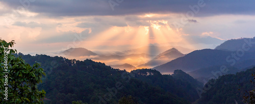 Sun's rays with colorful of sky in the evening or morning at famous mountain in Thailand