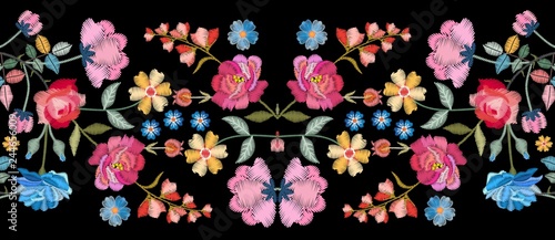 Colorful seamless embroidery border with beautiful flowers. Floral embroidered pattern on black background. Fashion print.