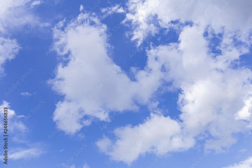 Blue sky background with white clouds, rain clouds on sunny summer or spring day. Blue sky background with white clouds, rain clouds on sunny summer or spring day.
