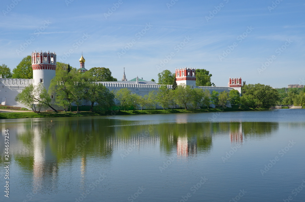 Spring view of the Novodevichy convent and the Big Novodevichy pond on a Sunny day, Moscow, Russia Spring view of the Novodevichy convent and the Big Novodevichy pond on a Sunny day, Moscow, Russia
