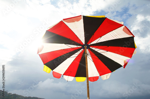 Beach umbrella on sky background