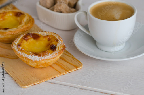 Pasteis de Belem, typical portuguese eggsweet with coffee at Lisbon cafe,Portugal. Pastel de nata sweets making to according to the Jeronimos Monastery secret recipe.