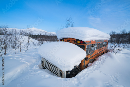Abandoned School Bus Covered in Snow Alaska