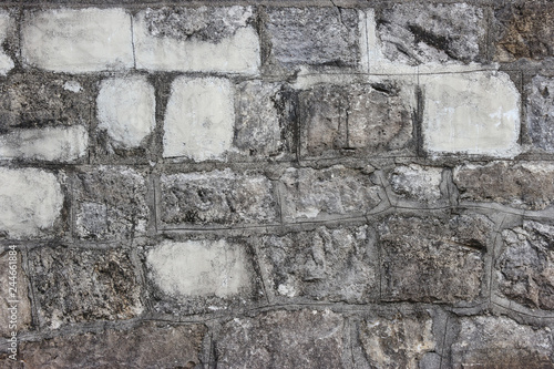 dirty aged stone blocks cement wall for any design texture background.