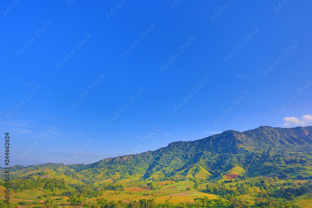Beautiful mountain landscape with mountain forest and blue sky in Thailand.