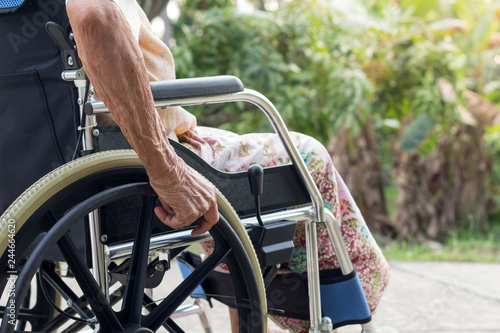Asian senior or elderly old lady woman patient on wheelchair at the front house,healthy strong medical concept