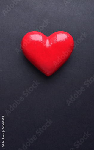 Valentines Day card with red heart and copy space on black background. 14 February Valentines day of love.