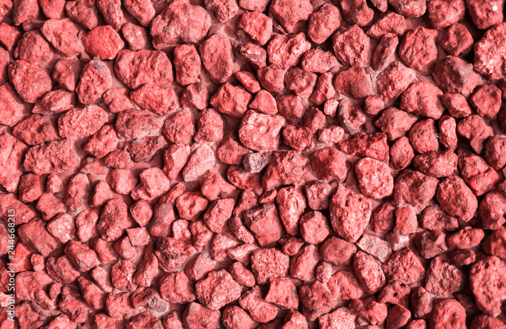 Trend photography on the theme of the new color of the year 2019 - Living Coral. Fragment of a wall from a chipped stone. Trend photography on the theme of the new color of the year 2019 - Living Coral. Fragment of a wall from a chipped stone.