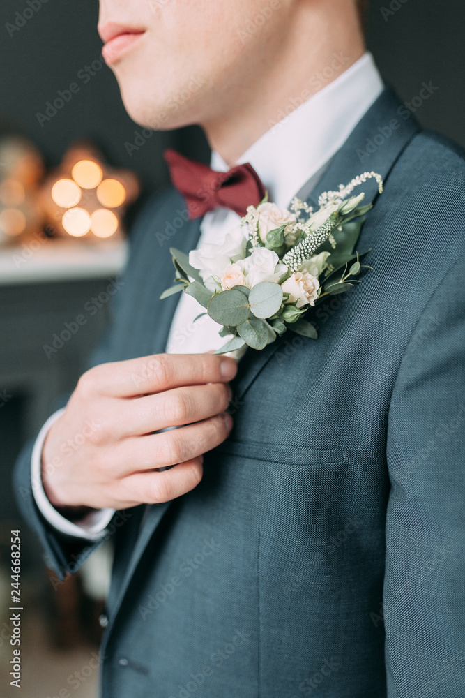 Stylish young groom in a bright Studio. Wedding in the European style fine art. Stylish young groom in a bright Studio. Wedding in the European style fine art.