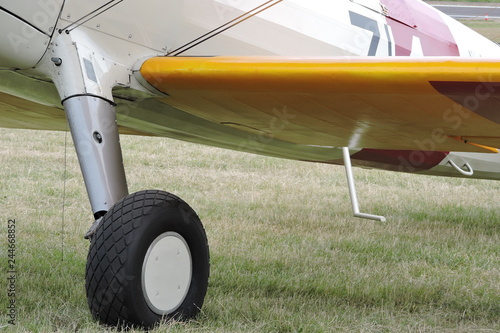 A wheel and a wing of a biplane