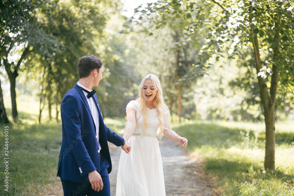 Young loving couple e walking through autumn park Young loving couple e walking through autumn park