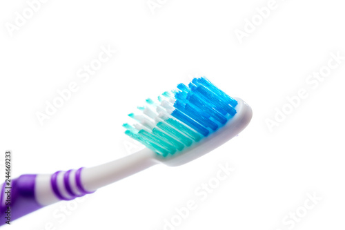 colored toothbrush on an isolated background  close up