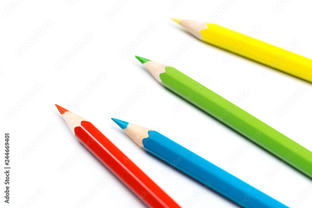 Colour pencils on white background, top view. Colour pencils on white background, top view.