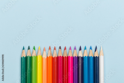 colour pencils on blue background.