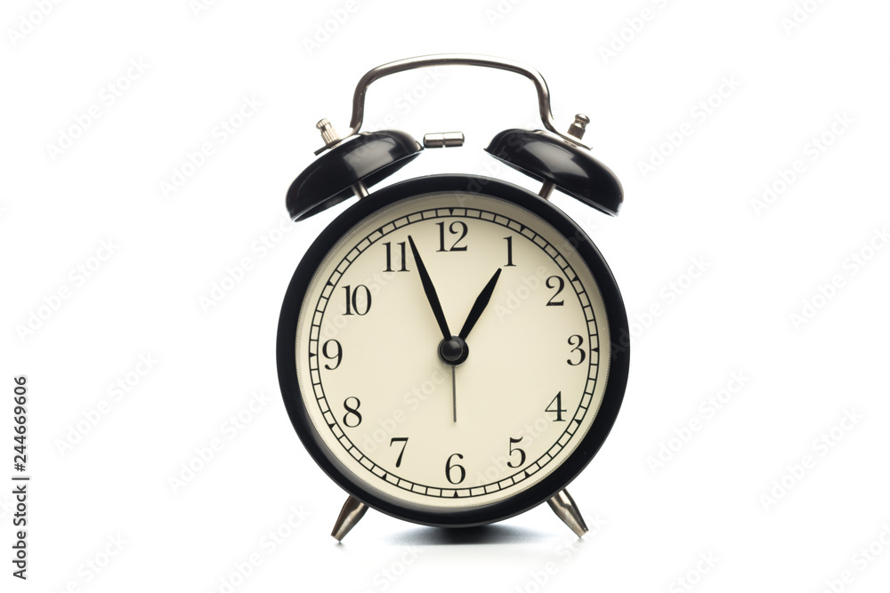 Black retro alarm clock on isolated background. Black retro alarm clock on isolated background.