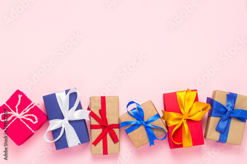 Many gift boxes on a pink background. Holiday concept, New Year, Christmas, Birthday, Valentine's Day. Copy space. Flat lay, top view.
