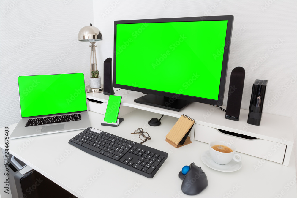 Computer and devices on modern white desk interior 3D rendering Computer and devices on modern white desk interior 3D rendering