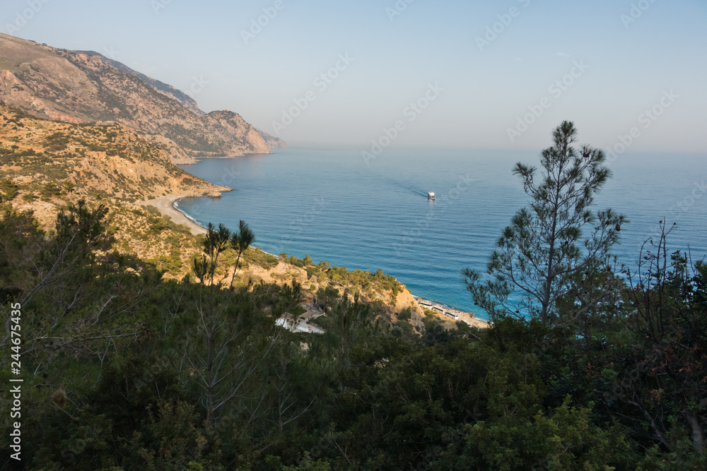 Viewpoint from a hiking trail near Lissos gorge to a coastline above Sougia bay at sunset, south-west coast of Crete island, Greece