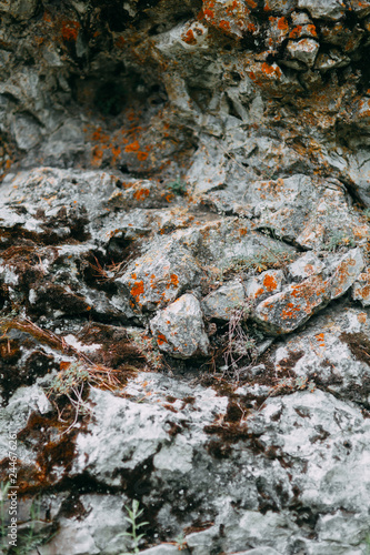 The bends of the river and the beautiful cliffs. Summer nature and texture of the stones with streaks.