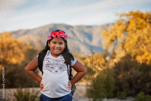 A pre teen female student wearing a backpack during a school field trip in California.